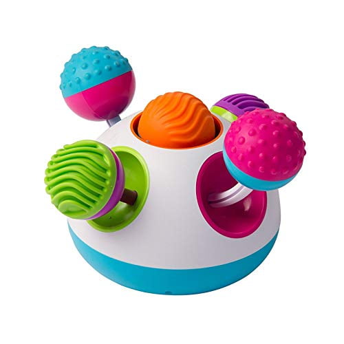 Fat Brain Toys Klickity sensory toy designed for early exploration, featuring a multicolour design with pink, blue, green, purple, orange, and teal elements. Includes textured rubber tops, spinning balls, click-in knobs, and rattling beads to encourage sensory exploration, cause-effect learning, and fine motor skill development. Measures approximately 7 inches in diameter and features rubber grips for stability.