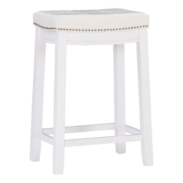 Linon Claridge Backless Counter Stool featuring a white faux leather upholstered seat with silver nailhead trim and double-needle stitching. The stool has a solid rubberwood frame painted in white with a built-in footrest for added comfort and stability. Designed with a seat height of 26.5 inches, it is ideal for counters and kitchen islands 35 to 39 inches high. The backless design allows for easy storage under counters, and the stool supports up to 350 lbs.
