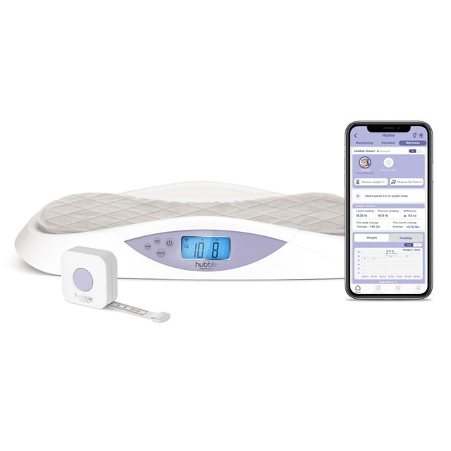 Hubble Grow Smart Baby Scale & Changing Pad with ergonomic white base and soft quilted grey washable cover, featuring a blue backlit LCD screen displaying weight in pounds and ounces, accompanied by a white and lavender retractable measuring tape and a smartphone showing the HubbleClub app tracking baby weight and feeding data.