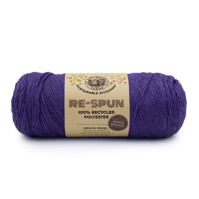 Lion Brand Re-Spun Bonus Bundle Yarn in heliotrope, a 284-gram skein of 100% recycled polyester yarn made from recycled plastics, with a natural brown label highlighting sustainable stitching and bonus bundle, suitable for machine washable knitting, crocheting, and eco-friendly crafts.