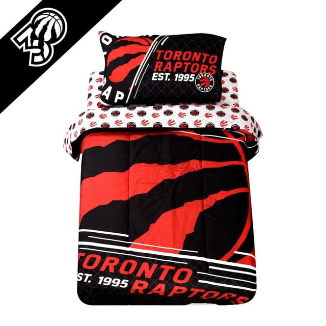 NBA Toronto Raptors 4-Piece Twin Bedding Set with reversible comforter featuring a large red and black Raptors claw logo and team name, pillowcase with Toronto Raptors logo and EST. 1995, and sheets printed with repeating small Raptors logos in red, black, and white polyester, suitable for kids' bedrooms.