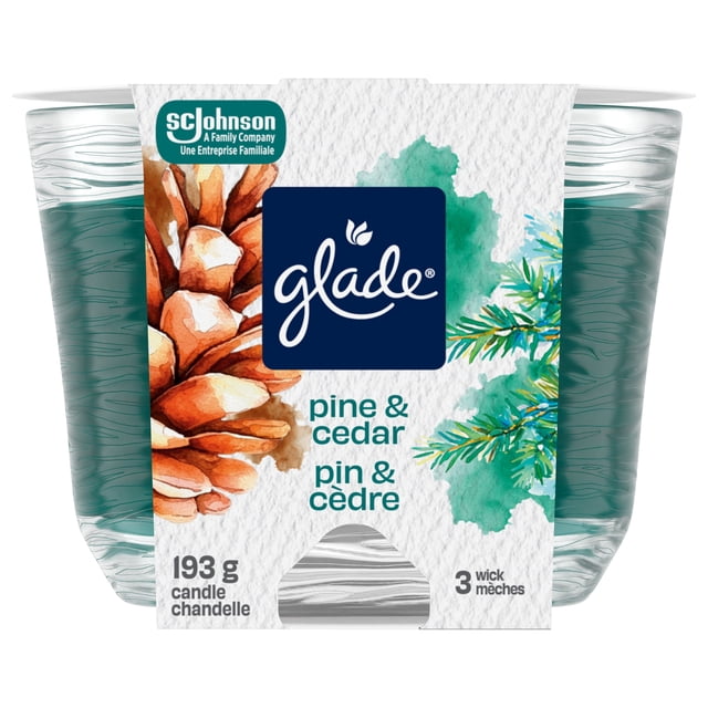 Glade® Scented 3-Wick Candle Air Freshener, Pine & Cedar, in a clear glass jar with textured pine green wax, wrapped in a white label featuring pine cone and cedar branch artwork, 193 g, ideal for indoor Christmas decorations and holiday ambiance.