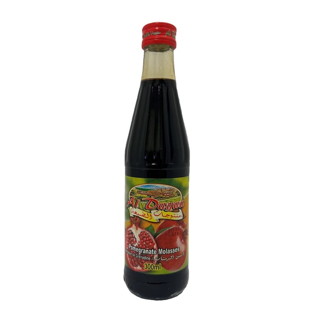 Al Dayaa Pomegranate Molasses 300ml bottle with red cap and label showing pomegranate fruit and Arabic text, containing dark syrup used as a sweetener and flavor enhancer in sweet and savory recipes, suitable for adding depth and complexity to dishes.