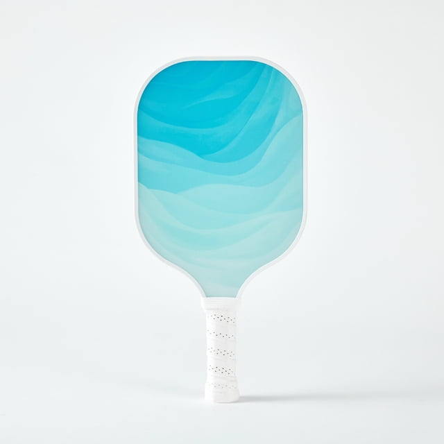 The Cielo Pickleball Paddle in Azure, featuring a G2P reinforced fiberglass surface and a reactive honeycomb core for enhanced power, control, and spin. The paddle has a textured blue surface with a white edge guard and an ergonomic handle wrapped in perforated faux leather for anti-slip comfort. Lightweight at 7.9 oz, it measures 15.7 inches in length and 7.9 inches in width, making it suitable for players of all ages and skill levels. USAPA approved for competition.