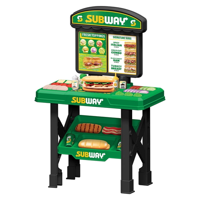 World Tech Toys Subway Sandwich Artist 53 Piece Playset for kids aged 3 and above. The playset features a green and black play counter with a Subway® logo, a menu board displaying sandwich options, and a variety of colorful toy ingredients including bread, meats, cheeses, and vegetables. Accessories like condiment bottles and trays are also included, encouraging creative roleplay and motor skill development.