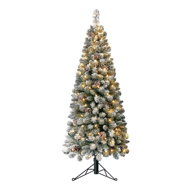 Home Heritage Corner 5' Flocked 100 LED Pre-Lit Artificial Christmas Tree with a slim, 14-inch wide profile and 224 flocked foliage tips. The tree features a snow-covered appearance with pinecones and 100 warm white LED lights, creating a festive glow. It includes a sturdy metal stand and is ideal for compact spaces or corner placement. Dimensions are 60 inches tall and 14 inches wide.