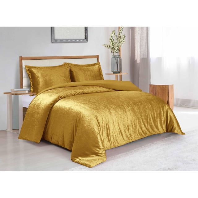 Swift Home Solid Crushed Velvet Duvet Cover Set in golden yellow on a wooden bed frame with white padded headboard, featuring soft crushed velvet fabric with subtle sheen and matching pillow shams, set in a bright bedroom with light wood flooring, side table with books, and vase of white flowers, ideal for adding warmth and luxury to bedroom decor.