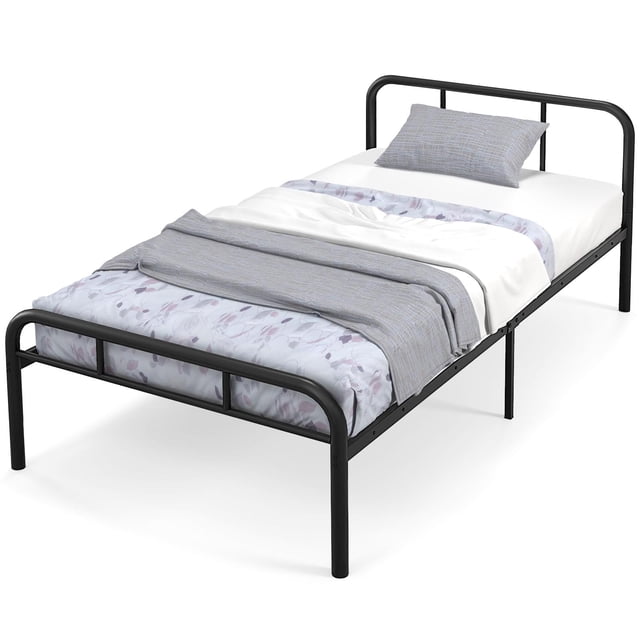 Giantex Cadre de Lit en Métal Double/Simple avec une structure en Acier Enduit de Poudre Noire, Comprenant une Tête de Lit et un Pied de Lit au design Minimaliste. le Cadre de Lit Comprend des Lattes en Acier Robustes pour la Durabilité et des Pieds de Soutien Renforcés pour la Stabilité. Il Offre 12 Pouces d'Espace de Rangement sous le Lit et Ne Nécessite Pas de Sommier. Présenté dans une Chambre avec de la Literie et un Oreiller.