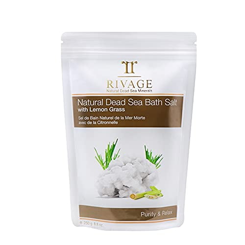 RIVAGE NATURAL DEAD SEA MINERALS Bath Salt Lemon Grass 250g in a resealable white pouch with a brown label. The packaging features an image of coarse white bath salts and fresh lemongrass, emphasizing its natural and therapeutic properties. Designed for calming irritated skin, relieving tired muscles, and rejuvenating the body with authentic Dead Sea minerals. Suitable for spa treatments and personal relaxation.