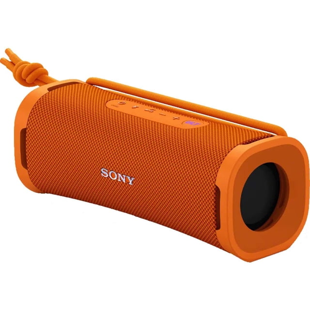 Sony ULT FIELD 1 Wireless Portable Speaker in orange with a compact cylindrical shape, textured mesh fabric, and detachable multi-way strap. Features top control buttons including a bass boost ULT button and side passive radiator. IP67 waterproof, dustproof, rustproof, and shockproof for outdoor use.