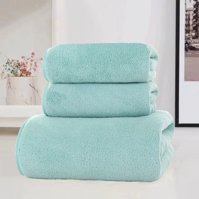 LSLJS Soft Linen Premium 3 Pc Towel Set in green, featuring one bath towel, one hand towel, and one washcloth. Made from 100% cotton, these towels are highly absorbent and quick-drying, ideal for bathrooms, spas, or gyms. The bath towel measures 27.55x55.11 inches, the hand towel 13.77x29.52 inches, and the washcloth 13.77x13.77 inches. Displayed stacked in a modern bathroom setting.