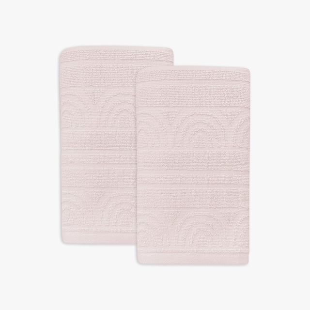 Mainstays Kids 2pk Hand Towel in pale pink featuring embossed rainbow and stripe patterns, made of 100% cotton, each measuring 15 x 26 inches, folded side by side on a white background, suitable for kids' bathroom use and coordinating with matching bath linens.