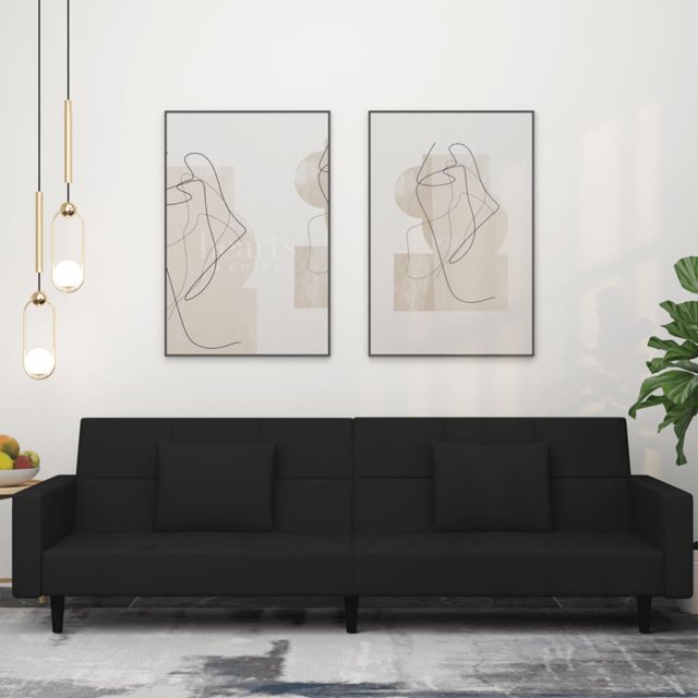 vidaXL 2-Seater Sofa Bed with Two Pillows in black velvet, shown in a modern living room setting. The sofa features a sleek design with a soft velvet finish and includes two matching square pillows. It has a wooden frame for stability and can be easily converted into a bed. Dimensions as a sofa are 220 x 84.5 x 69 cm, and as a bed, 220 x 100 x 52 cm. Suitable for living rooms, home theatres, or small spaces.
