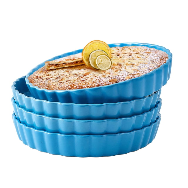 Bruntmor 10" Blue Ceramic Pie Pans Set of 4 displayed in a stacked arrangement with a baked pie topped with lemon slices on the top pan. The vibrant blue bakeware features a scalloped edge design, perfect for baking pies, quiches, or serving dishes. Made from durable ceramic, they are oven safe up to 500F and suitable for microwave, refrigerator, and dishwasher use.