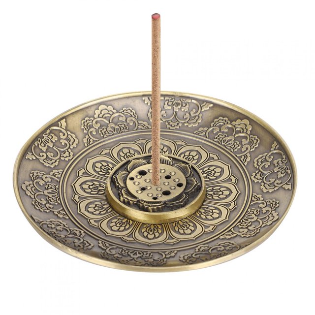 Flower Pattern Incense Holder made of durable zinc alloy, featuring an antique floral design with intricate carvings. The set includes a 9.7 cm diameter incense plate and a removable 9-hole incense holder, suitable for various types of incense. Ideal for use in living rooms, temples, offices, hotels, teahouses, or yoga spaces.