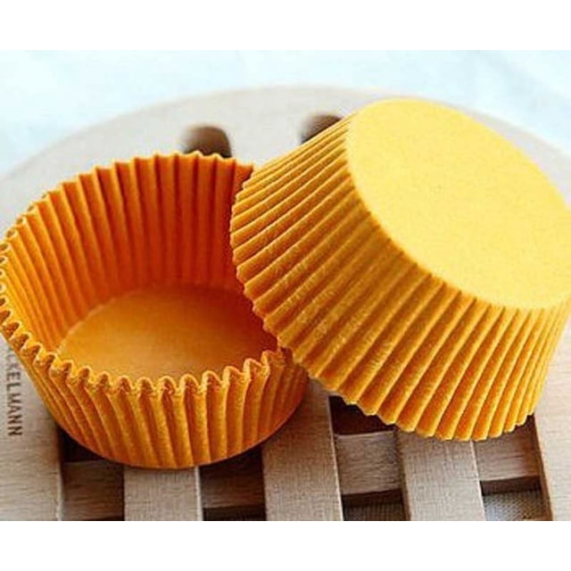 EGNMCR 480 PCS Paper Cake Cup Liners Baking Cup Muffin Kitchen Cupcake Cases in yellow color. These paper liners have a bottom width of 3.4 cm and a height of 2.6 cm, ideal for baking cupcakes or muffins. The image shows two yellow liners, one upright and the other inverted, placed on a wooden surface. Made from environmentally friendly paper, these liners are lightweight at 70g and come in a pack of 480 pieces.