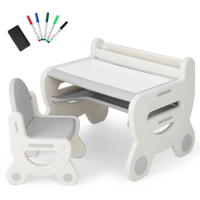 Costway Kids Drawing Table & Chair Set featuring a white and gray design with an erasable graffiti tabletop. Includes a matching ergonomic chair, five markers, and an eraser. The table has built-in storage options such as a bookshelf, pen slot, and under-desk storage. Made of durable HDPE and PP materials with rounded corners and non-slip foot pads for safety. Suitable for children aged 3-8 years for activities like drawing, reading, and playing.