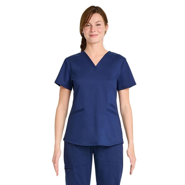 Scrubstar Haut de Sarrau à Col en V Extensible Ultime pour Femmes WC854A Haut de Sarrau à Col en V pour Femmes Orienté vers l'Avant sur mannequin à Manches Courtes, Trois Poches (Deux Poches Plaquées Inférieures et une Poche Poitrine), Tissu Tricoté Lisse et Extensible avec Légère Brillance, Coupe Droite Flatteuse; Tissu Antimicrobien PROTX2TM Noté dans les Spécifications du Produit.