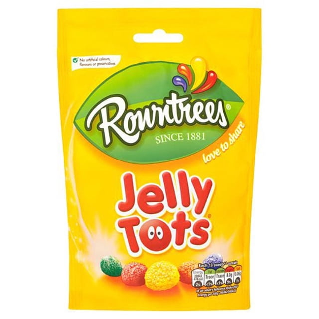 Rowntree Jelly Tots Pouch with bright yellow packaging featuring the Rowntrees logo on a green leaf, showing five colourful jelly sweets in blackcurrant, lemon, strawberry, lime, and orange flavours made with real fruit juice and no artificial colours or preservatives, suitable for a playful snack.