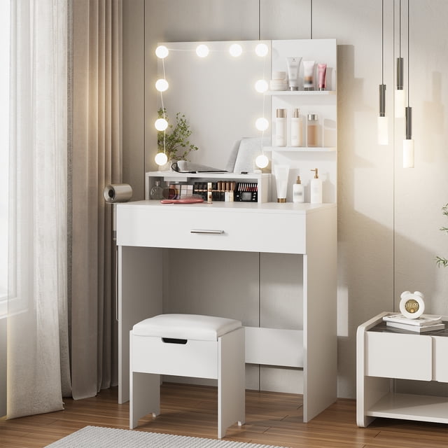 Vabches Makeup Vanity Table with Lighted Mirror & Power Strip in white, featuring a large mirror with 10 dimmable LED bulbs offering 3 lighting modes: warm yellow, warm white, and cool white. The vanity includes a built-in charging station with 2 outlets and 2 USB ports, a dedicated hair dryer rack, and ample storage with spacious drawers and 3 shelves. The set comes with a soft cushioned stool with additional storage. Dimensions are 31.5 inches wide, 15.8 inches deep, and 57.7 inches tall. Ideal for bedrooms, salons, or livestreaming.