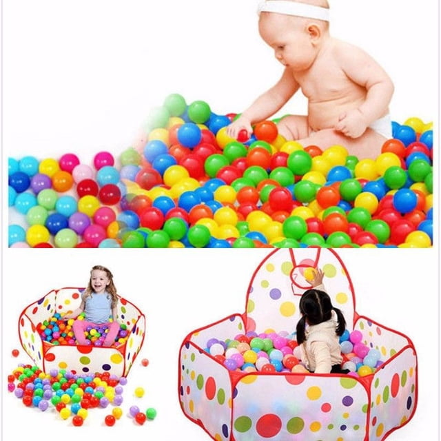 Honganda Secure Baby Kid Pit Toy Swim Fun Colorful Soft Plastic Ocean Ball 50mm. A set of multicoloured plastic balls with a 55mm diameter, designed for ball pits, playhouses, kiddie pools, and other play areas. The balls are soft, flexible, non-toxic, and come in a mix of 7-10 bright colours. The image shows children playing in a ball pit filled with these vibrant balls, highlighting their suitability for entertainment and family use. Available in sets of 20, 50, or 100 pieces, with a reusable mesh bag for storage.