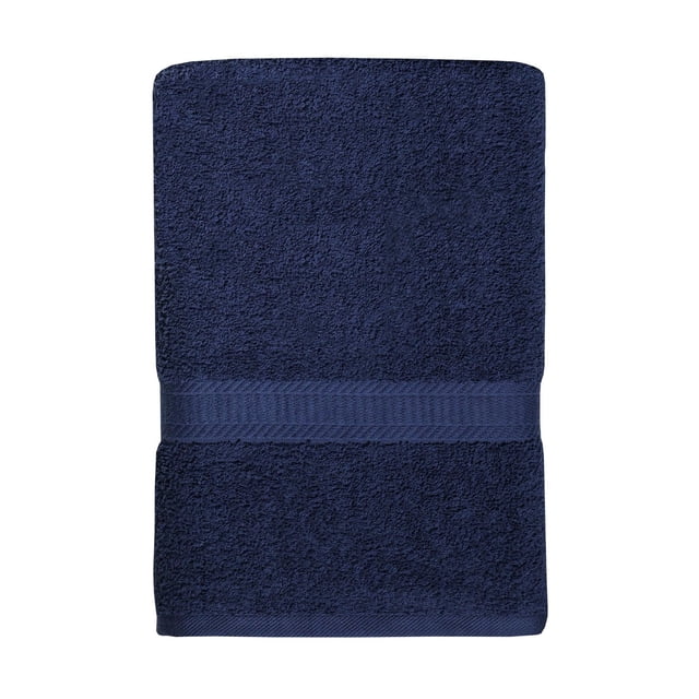 Mainstays Basics Solid Bath Towel in navy blue, folded flat to show its soft, absorbent 100% cotton texture with a decorative woven band, measuring 27 by 52 inches, ideal for everyday bathroom use and machine washable for easy care.