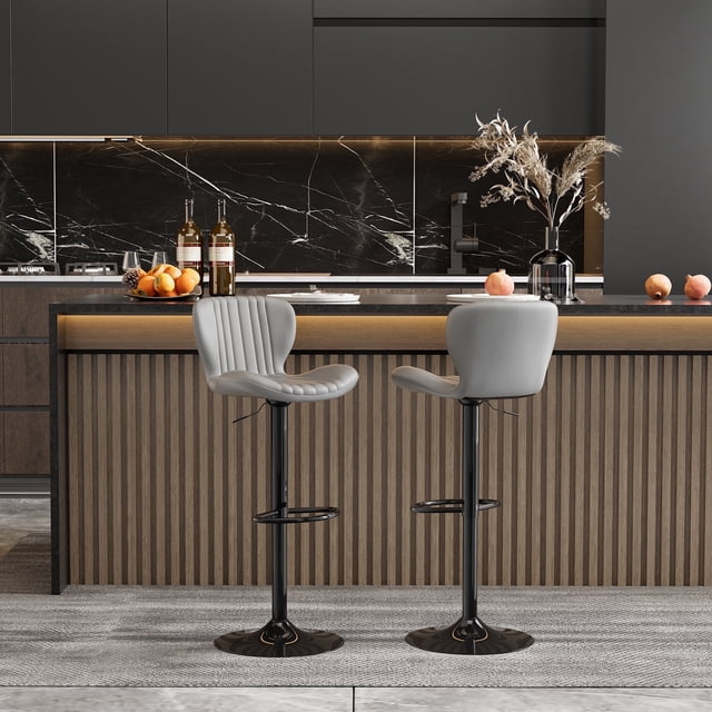 Walsunny Adjustable Bar Stools Set of 2 in grey leather upholstery, featuring swivel counter seats with a scalloped design and large metal bases. The stools are shown in a modern kitchen setting with a black marble backsplash and a wooden counter. The adjustable height and 360-degree swivel functionality are highlighted, along with the non-slip base for safety and floor protection.