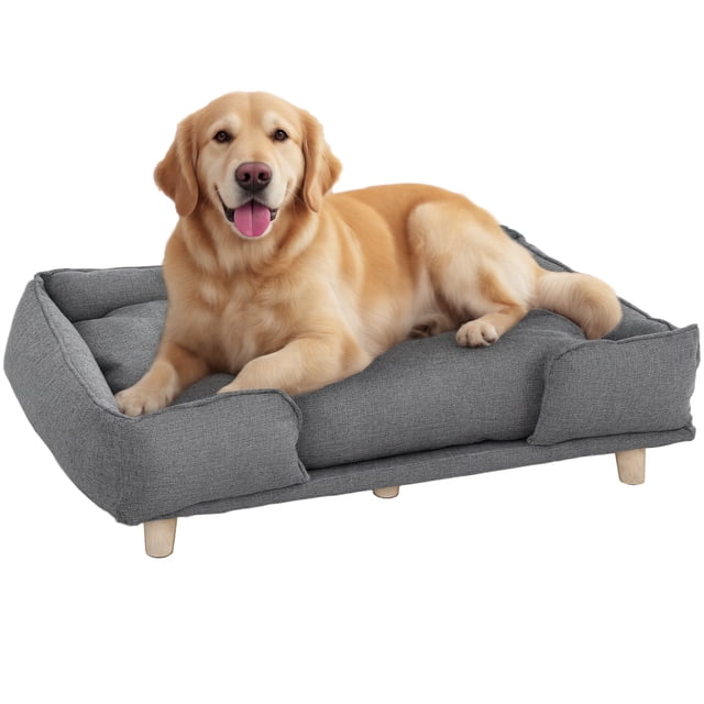 PawHut Elevated Washable Dog Sofa for Large Dogs in dark grey, featuring a soft 3.1-inch padded cushion and raised sides for comfort and security. The sofa has a durable MDF frame, non-slip foot pads, and pine wood legs for stability. Suitable for large dogs up to 66 lbs and 23.6 inches in size. Dimensions are 37.8 inches long, 26 inches wide, and 9.4 inches high. A golden retriever is shown resting on the sofa.