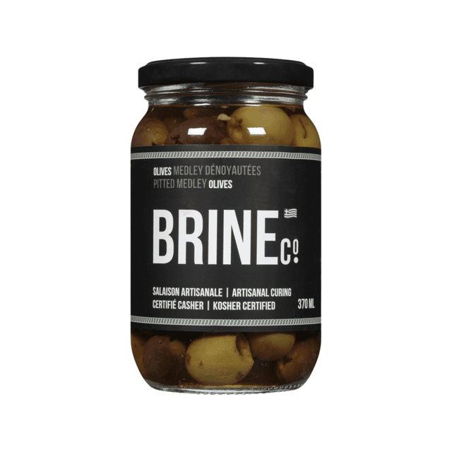 Brine Co Pitted Medley Olives 370ML Jar with green and Kalamata olives in a clear glass jar sealed by a black lid, labeled for artisanal curing and kosher certification, featuring a Mediterranean herb-infused blend ideal for pantry condiments and Mediterranean dishes.