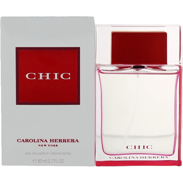 Chic Eau De Parfum Spray by Carolina Herrera, an 80ml perfume for women with a sleek transparent bottle featuring red accents, paired with a matching box showcasing bold red branding. This floral fragrance, launched in 2002, blends mandarin orange, vanilla, freesia, and Bulgarian petals, perfect for daytime wear.