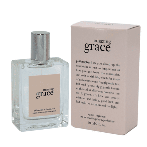 Philosophy Amazing Grace Spray Fragrance 2oz, a clean and floral perfume for women, presented in a clear glass bottle with a minimalist design and silver cap, paired with a soft pink box featuring black text. The scent includes citrus top notes, a floral heart, and a warm musk base.