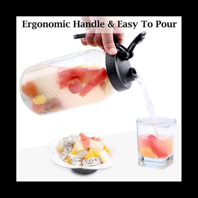 Cold Brew Coffee Maker 32oz Cold Brew Pitcher with Stainless Steel Super Dense Filter for Iced Brew Coffee, shown in use pouring fruit-infused water into a glass. The thick glass jar features a black spout lid with an ergonomic handle for easy pouring. The pitcher is filled with colorful fruit slices, highlighting its multipurpose use for beverages like iced tea, lemonade, and homemade drinks. Includes a stainless steel filter and cleaning brush.