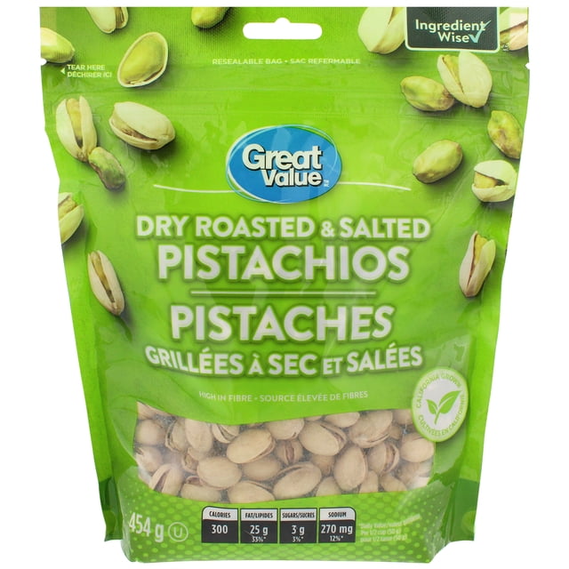 Great Value Dry Roasted & Salted Pistachio Nuts 454g resealable bag with green packaging featuring scattered pistachio nuts and a clear window showing dry roasted pistachios inside, high in fibre and California grown, often used as a topping for ice cream and yogurt.