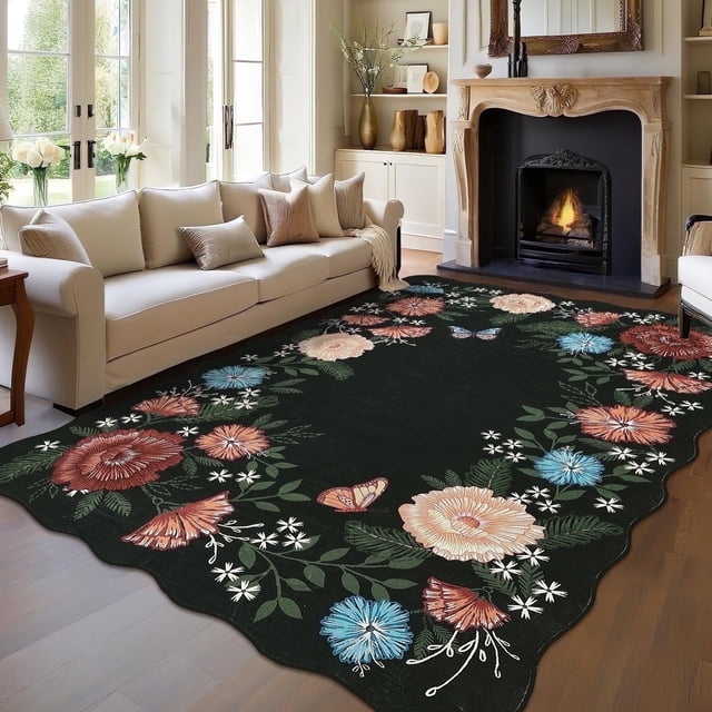 Garvee 8'x10' Floral Area Rugs in black, featuring a boho-inspired design with colorful floral motifs and butterflies. This washable, ultra-soft polyester rug has a low 0.3-inch pile height and a non-slip thermoplastic rubber backing, making it ideal for high-traffic areas like living rooms, bedrooms, and dining rooms. The rug is shown in a cozy living room setting with a fireplace and neutral-toned furniture, complementing the space with its vintage and decorative appeal.