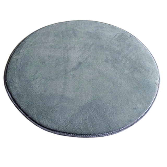 Round Solid Coral Velvet Memory Foam Carpets Area Rug Bedroom Doormat Floor Mat Mats in a circular shape with a solid grey colour. Made from 100% polypropylene with a soft coral velvet surface and non-slip backing for safety. Designed for use in living rooms, bedrooms, nurseries, and more. Easy to clean and machine washable, with a diameter of 80 cm.