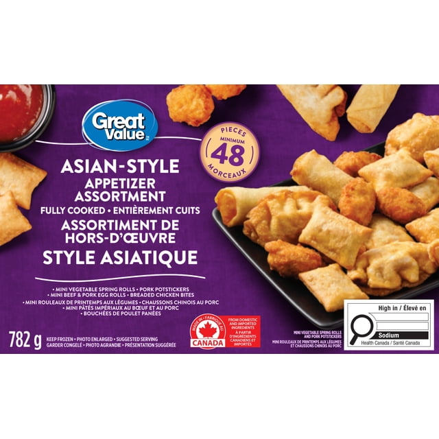 Great Value Frozen Asian-Style Assortment Appetizers showing a variety of fully cooked bite-sized appetizers including mini vegetable spring rolls, pork potstickers, mini beef and pork egg rolls, and breaded chicken bites on a black tray with a purple background and Canadian made label, weighing 782 grams, suitable for party serving or casual snacking.
