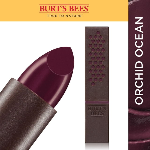 Burt’s Bees 100% Natural Moisturizing Lipstick in Orchid Ocean shade with a close-up of the deep plum lipstick bullet and the brown rectangular tube featuring honeycomb cutouts and embossed Burt’s Bees logo, showing its creamy texture and satin finish, suitable for natural lip care.
