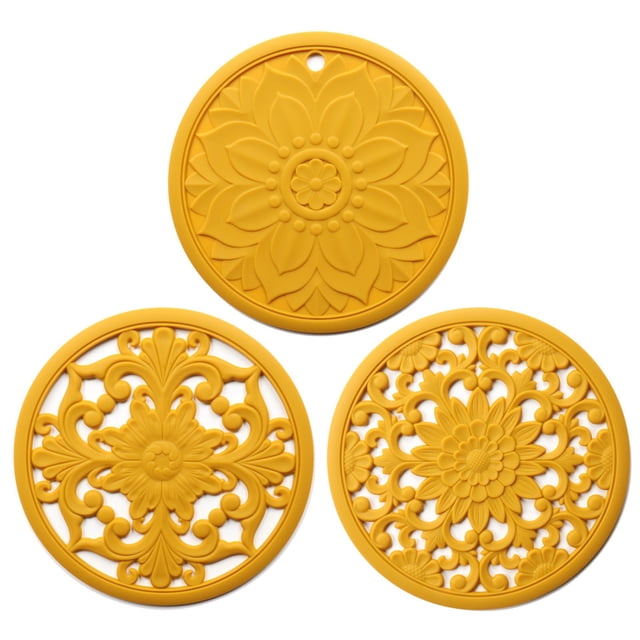 Silicone Trivets for Hot Pots and Pans, a set of three round silicone trivet mats with intricate carved floral and decorative patterns in bright yellow. Made from food-grade, BPA-free silicone, these mats are heat resistant up to 482°F, protecting countertops and tables from hot pots, pans, and bakeware. Each trivet measures 7.87 inches in diameter and 0.21 inches thick, providing a durable, non-slip surface. Dishwasher safe and easy to clean, they are versatile for use as pot holders, jar openers, spoon rests, or kitchen table mats.