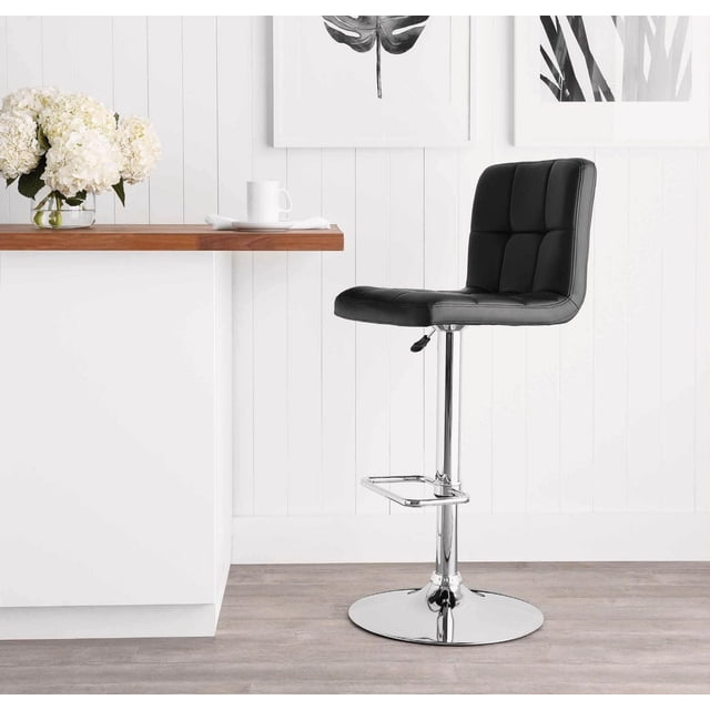 Hometrends Quilted Swivel Bar Stool with black PU faux leather seat and hi-back silhouette, chrome pedestal base with circular footrest and gas lift adjustable height, placed beside a white kitchen island with wooden countertop and floral decor, ideal for kitchen and dining seating.