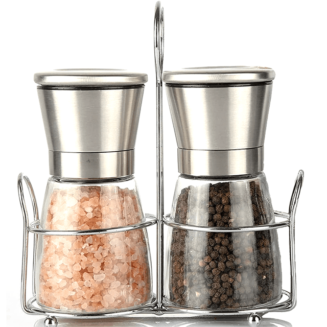 Salt and Pepper Grinder Set with two grinders featuring stainless steel tops and BPA-free glass bottles, shown in a metal holder. One grinder is filled with pink Himalayan salt, and the other with black peppercorns. The set includes an adjustable ceramic grinding mechanism for customizable coarseness and a wide-caliber design for easy refilling. Suitable for daily use and keeping spices fresh.