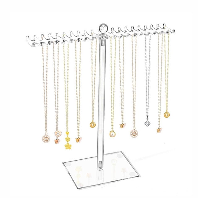 Dvkptbk Display Stand Necklace Organizer Clear Necklace Stand Jewelry Organizer Display Tree Hanger Rack with Hooks for Necklaces, Chain, Pendant, Bracelets, and Ring Organization and Storage. Made of clear acrylic with a snowflake shape design, this stand features a rotating base with a non-slip pad for stability. It includes rows of hooks on both sides, accommodating up to 84 necklaces, bracelets, or rings. Dimensions are 11.5x3.3x11.6 inches, and it is lightweight at 0.33 lbs. Ideal for dorms, RVs, or home offices.