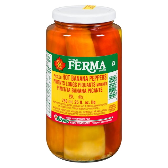 Ferma Pickled Hot Banana Peppers in a 750 ml clear glass jar with a white lid, showing whole yellow and orange banana peppers in brine, labeled with green and yellow Ferma branding and bilingual product details, ideal as a spicy condiment or topping for salads and sandwiches.