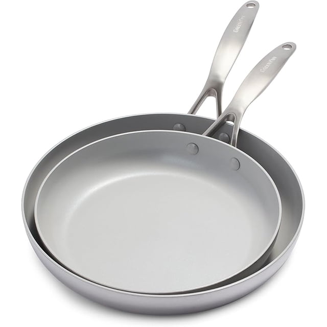 GreenPan Venice Pro Tri-Ply Stainless Steel Healthy Ceramic Nonstick 10" and 12" Frying Pan Skillet Set. This set includes two grey skillets with a diamond-infused Thermolon ceramic nonstick coating for durability and easy cleaning. The pans feature riveted stainless steel handles and a 3-ply stainless steel body with Evershine technology to prevent discoloration. Compatible with all stovetops, including induction, and oven safe up to 600°F.