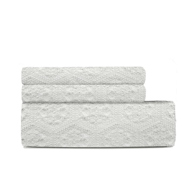 Johnson Home Cotton Quilts Set Persian Hexagon Ivory queen-sized quilt and two shams in breathable 200 thread count cotton with textured hexagon floral quilting, folded on white background, ideal for durable and comfortable bedding refresh.
