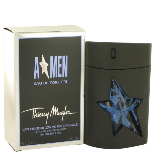 3.4 oz Eau De Toilette Spray Refillable (Rubber) by Thierry Mugler, featuring a black rubber bottle with a blue star design and a matching box labeled 'A*Men Eau de Toilette.' This men's fragrance, launched in 1996, offers a sharp, oriental, woody scent with notes of mint, coffee, caramel, lavender, and tar. Suitable for daytime wear.