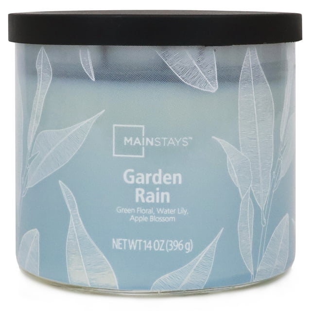 Mainstays 3-Wick Textured Wrapped Garden Rain Scented Candle, 14 oz, in a light blue glass jar with white botanical leaf designs and a black lid, scented with green floral, water lily, and apple blossom, suitable for home décor and relaxation.
