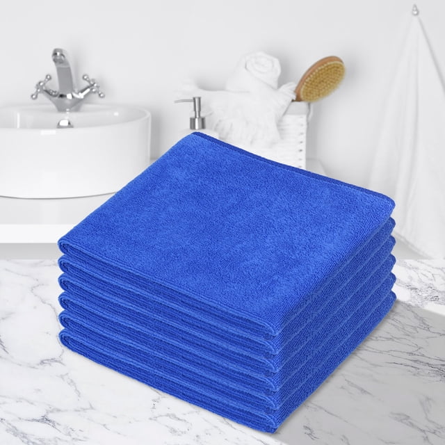 Fridja Super Soft Washcloths Towel Set 6 Pack in blue, featuring highly absorbent and soft material suitable for bathroom, hotel, spa, and kitchen use. These multi-purpose hand towels and face cloths measure 11.8'' x 27.5'' and are displayed stacked neatly on a marble countertop in a bathroom setting.