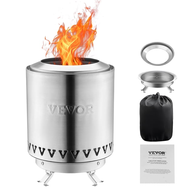 VEVOR Foyer de Table Fire Pit de 6 Pouces en Acier Inoxydable Argent, Présentant un design Cylindrique compact avec une Flamme Sans Fumée. le Fire Pit Comprend une base Détachable, un Anneau de Concentration de Feu et un Sac de Rangement pour la Portabilité. Fabriqué en Acier Inoxydable Résistant à la Corrosion, Il Convient à une Utilisation Intérieure et Extérieure, comme le camping Ou les Rassemblements sur patio. l'Image Montre le Fire Pit avec des Flammes Visibles, aux Côté de Ses Composants et Accessoires.