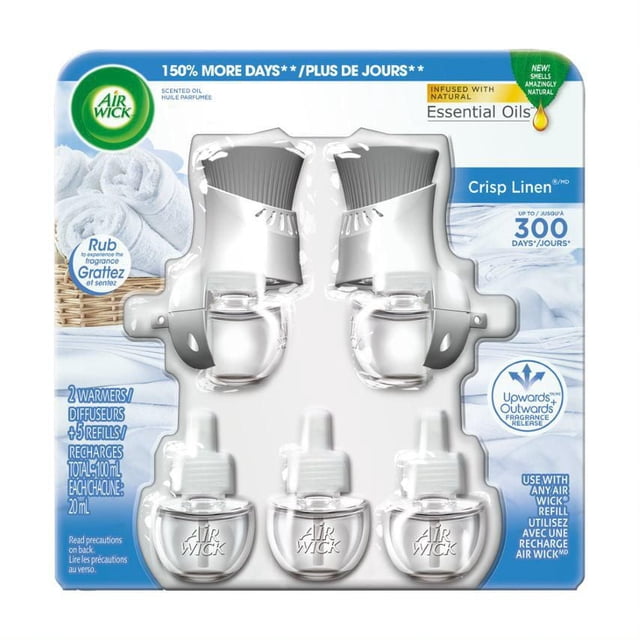 Air Wick Scented Oil Crisp Linen, 2 Gadget + 5 Refill, 100 milliliter pack with two white plug-in warmers and five clear oil refills embossed with Air Wick logo, infused with natural essential oils for up to 300 days of continuous fragrance, releasing scent upwards and outwards, ideal for use in any room or office.