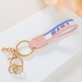 thumbnail image 1 of Short Fabric Embroidered Keychain for Mother's Day, Handmade Crochet Design with Leather Details, Measuring 15.5x3x1cm, Ideal as Key Accessory or Gift, 1 of 6